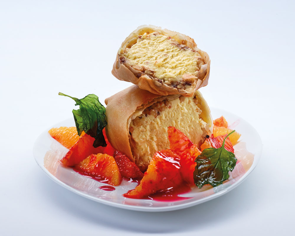 Paquetitos de helado de nuez con naranjas al cassis